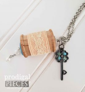 Blue Key Charm with Pink Lace on Vintage Wooden Spool Necklace available at shop.prodigalpieces.com