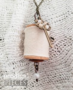 Closeup of Pearlescent Key Wooden Spool Necklace | shop.prodigalpieces.com